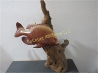 fish sculpture on wood log apx 18" h 395.00 retail