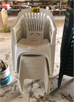 Stack of (16) white plastic chairs