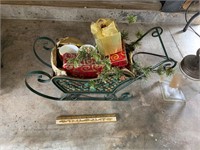 sleigh with metal boxes and 2 mugs