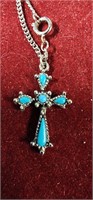 Pretty silver toned cross with turquoise