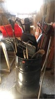 Barrel full of hand garden tools