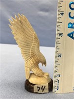 Carved eagle 4.25" from antler, imported on hardwo
