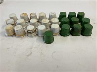 CONTAINER OF OIL BOTTLE CAPS AND 6 SMALL BOTTLES
