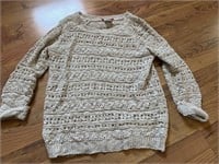 D1) Woman’s Large sweater. Tan color with gold