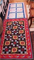 Two hooked throw rugs: one decorated