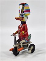 TIN WIND UP DUCK RIDING TRICYCLE