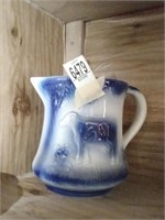 Blue & white ceramic picture with cow detail