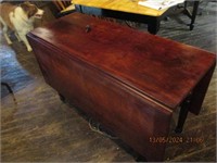 PRIMITIVE DROP LEAF CHERRY TABLE ON WOODEN CASTERS