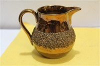 A Lusterware Ceramic Creamer