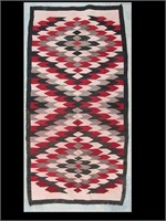 NAVAJO RUG - 58" X 29" IN GOOD CONDITION W/ RED