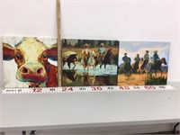 A cow and the cowboys on canvas