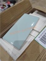 Box of ceramic wall tile pieces