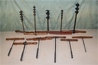 11 antique wood and steel augers; as is
