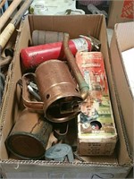 Box of oil cans and fire extinguishers