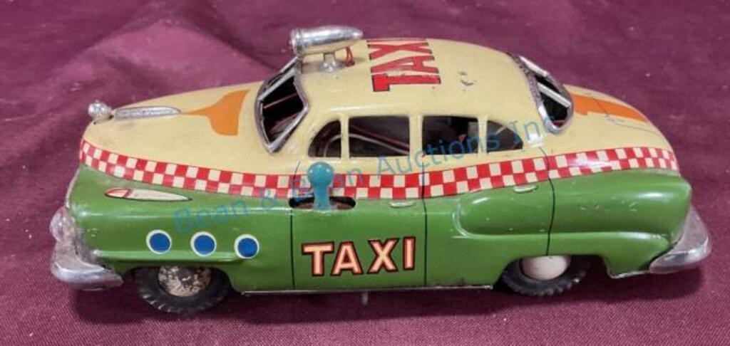 Early tin battery operated taxi