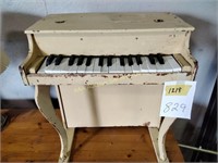 Toy piano. Rough condition