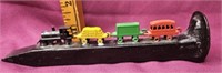 Railroad spike with tiny trains