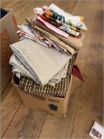 box of linens, table cloths