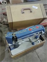 Vintage white sewing machine with case