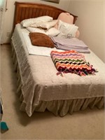 Full size bed with bedding
