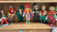 Shelf lot with seven different standing clowns -