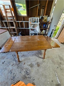 Wooden table with pull out leaves