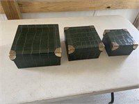 Three decorative storage boxes