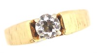 Diamond solitaire and yellow gold ring