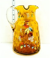 Vintage amber pitcher w/ enamel flowers