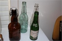 Lot of four vintage and antique bottles