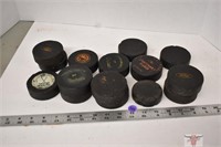 Box of Old Hockey Pucks with advertising