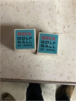 Two zippo golf balls