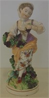 Early continental lady with fruit basket figurine
