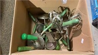 Box of vintage green handled kitchen utensils.