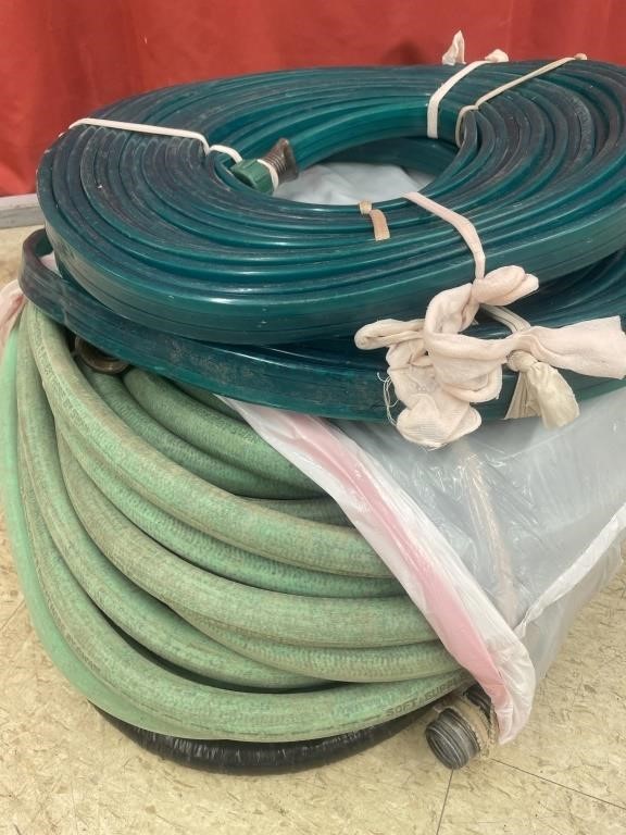 Two rolls of soaker hose and a length of garden