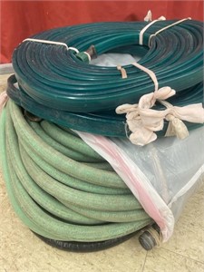Two rolls of soaker hose and a length of garden