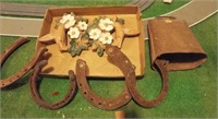 Antique cow bell with horse shoes, etc.