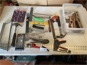 Assorted tools with tote, hammers, bars, pipe