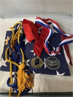 Flag (150”x 33.5”), cords, and Medals from