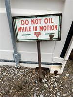 "Do Not Oil While in Motion" Metal Sign