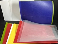 Lot of plastic cutting boards.