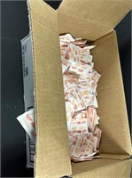 Box of domino sugar packets. ¾ full