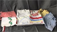 Group of vintage kitchen linens and aprons and