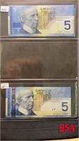sheet with 2 Canadian $5 bills