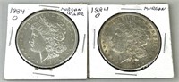 Pair of 1884-O Morgan Silver Dollars.