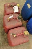 Three 5 gallon jerry jugs used for kerosene