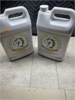 Two jugs of CAMELINA oil