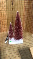 Red Christmas trees with snow