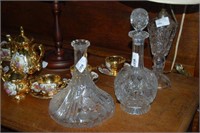 2 crystal decanters one with stopper, one without