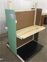 Pegboard two sided shelving unit on casters.  54